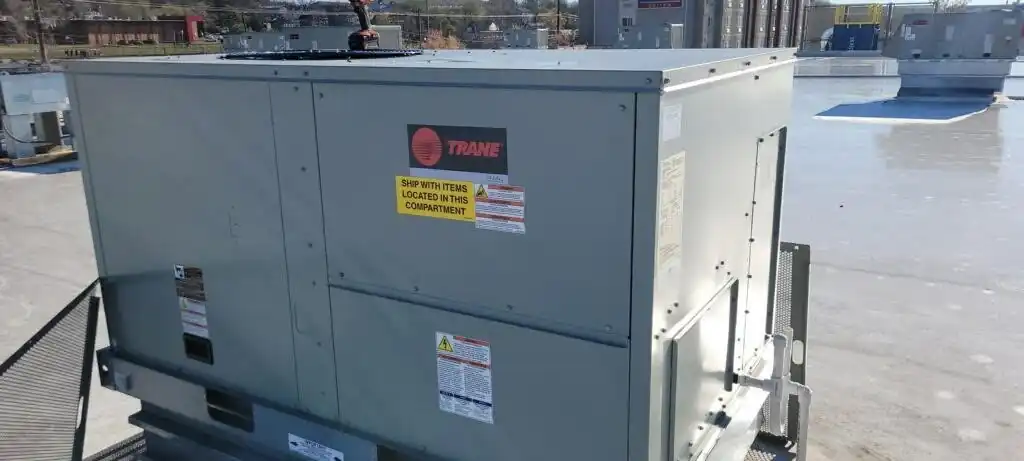 A Trane rooftop package unit sitting on a commercial roof